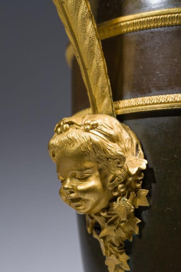 Coronari Auctions BVAn impressive pair of French Empire gilt and patinated bronze ewers on marble bases, attributed to Claude Galle, ca. 1800-1810