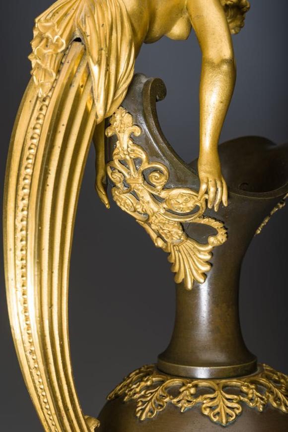 Coronari Auctions BVAn impressive pair of French Empire gilt and patinated bronze ewers on marble bases, attributed to Claude Galle, ca. 1800-1810