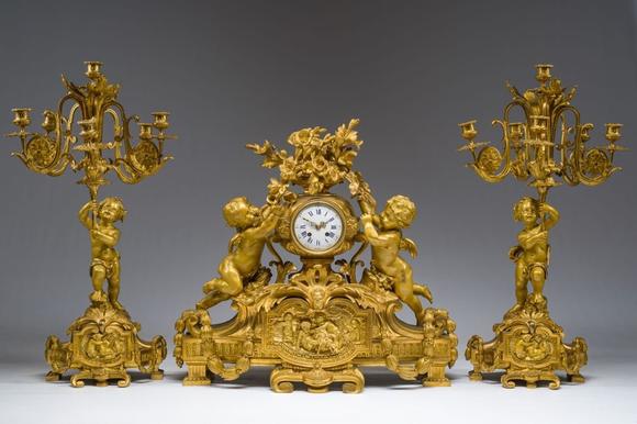 Coronari Auctions BVA fine and exceptional French Napoleon III gilt bronze three-piece clock garniture with putti and floral design, 19th C.