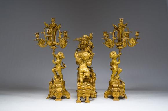 Coronari Auctions BVA fine and exceptional French Napoleon III gilt bronze three-piece clock garniture with putti and floral design, 19th C.