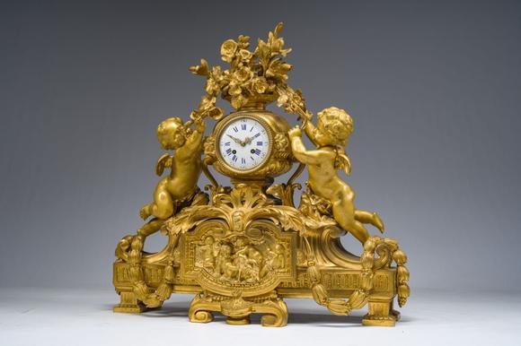 Coronari Auctions BVA fine and exceptional French Napoleon III gilt bronze three-piece clock garniture with putti and floral design, 19th C.