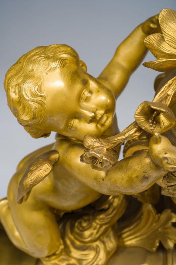 Coronari Auctions BVA fine and exceptional French Napoleon III gilt bronze three-piece clock garniture with putti and floral design, 19th C.