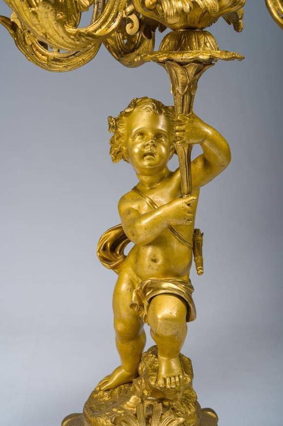 Coronari Auctions BVA fine and exceptional French Napoleon III gilt bronze three-piece clock garniture with putti and floral design, 19th C.