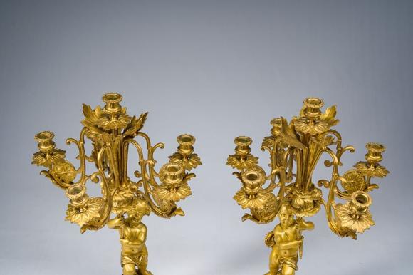 Coronari Auctions BVA fine and exceptional French Napoleon III gilt bronze three-piece clock garniture with putti and floral design, 19th C.