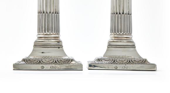 DreweattsA PAIR OF VICTORIAN SILVER CANDLESTICKS, WILLIAM HUTTON & SONS LTD., LONDON 1895