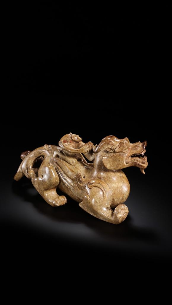 JUBAO HALL AUCTION HOUSE INCPre-Ming Dynasty Feathered Man Taming a Beast
