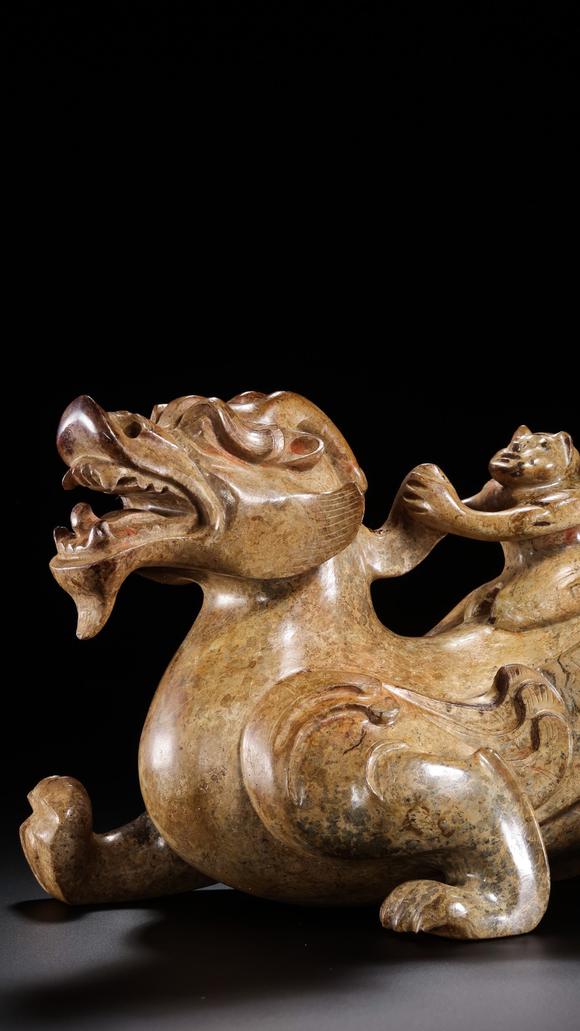 JUBAO HALL AUCTION HOUSE INCPre-Ming Dynasty Feathered Man Taming a Beast