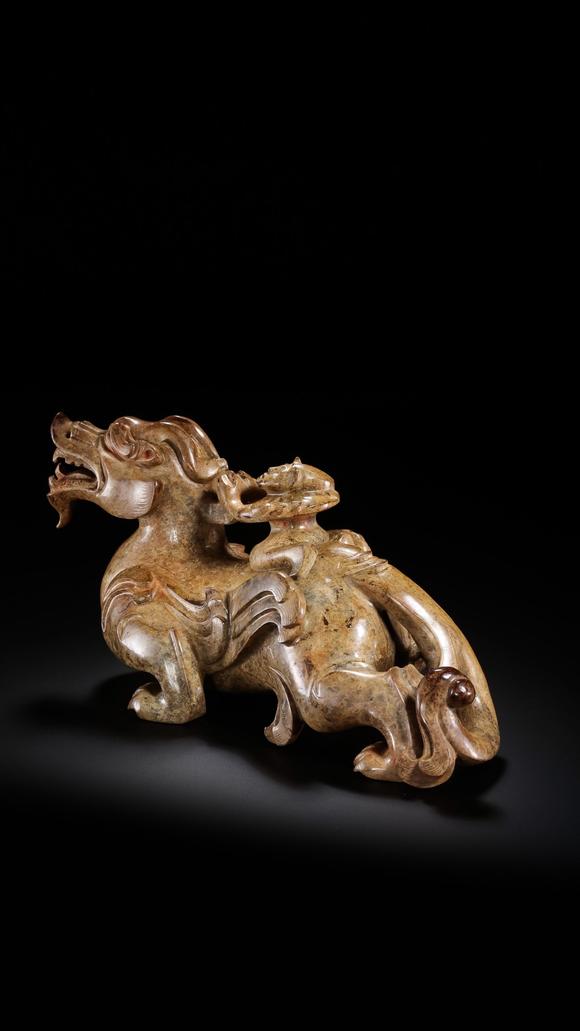 JUBAO HALL AUCTION HOUSE INCPre-Ming Dynasty Feathered Man Taming a Beast