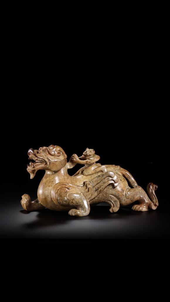 JUBAO HALL AUCTION HOUSE INCPre-Ming Dynasty Feathered Man Taming a Beast