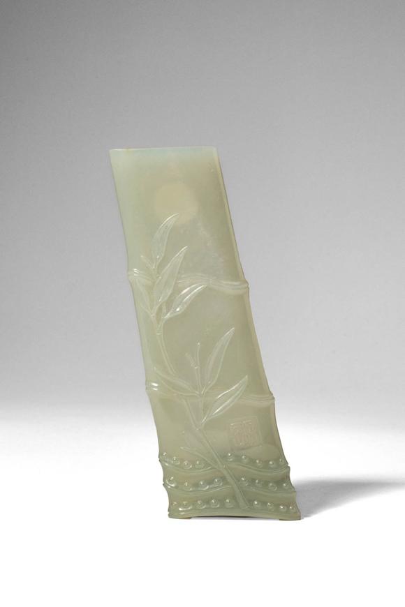 Apollo Art AuctionsQing Dynasty, Ca. AD 1644 - 1912. >
A carved celadon jade brush rest in the form of a naturalisti