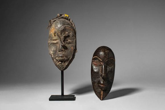 Apollo Art AuctionsCa. late 19th - early 20th century AD. >
A group comprising two carved wooden miniature masks of