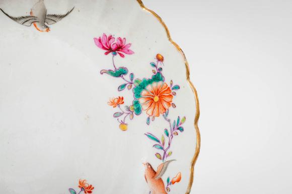 Apollo Art AuctionsMid Qing Dynasty, Ca. 18th century AD. >A famille rose porcelain dish of shallow, lobed form with