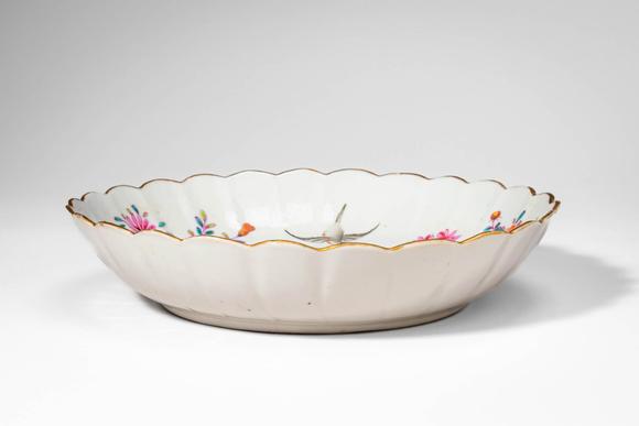 Apollo Art AuctionsMid Qing Dynasty, Ca. 18th century AD. >A famille rose porcelain dish of shallow, lobed form with