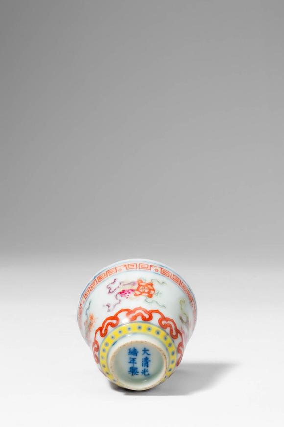 Apollo Art Auctions. >
A porcelain cup of slightly flared form, resting on a neatly trimmed foot, and decorated in a