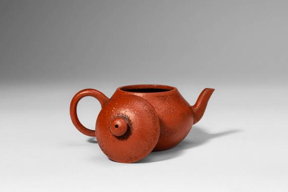 Apollo Art AuctionsQing Dynasty, Ca. AD 1644 - 1912. >A Yixing stoneware teapot of compact, globular form, the round