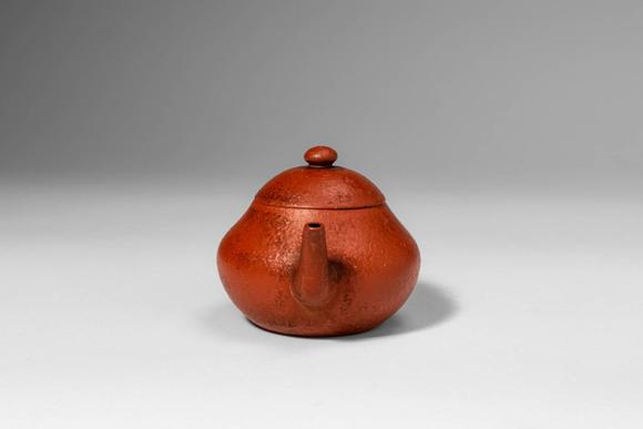 Apollo Art AuctionsQing Dynasty, Ca. AD 1644 - 1912. >A Yixing stoneware teapot of compact, globular form, the round