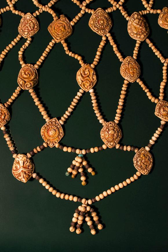 Apollo Art AuctionsCa. 16th - 17th century AD. >
An elaborate ritual bone apron composed of intricately carved plaqu