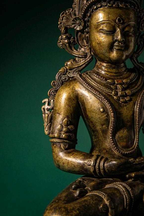 Apollo Art AuctionsCa. 14th century AD. >
A finely cast copper alloy figure depicting Kunzang Akor, seated in serene