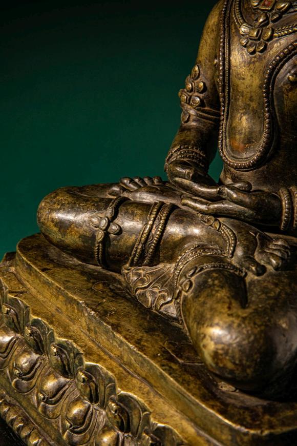 Apollo Art AuctionsCa. 14th century AD. >
A finely cast copper alloy figure depicting Kunzang Akor, seated in serene