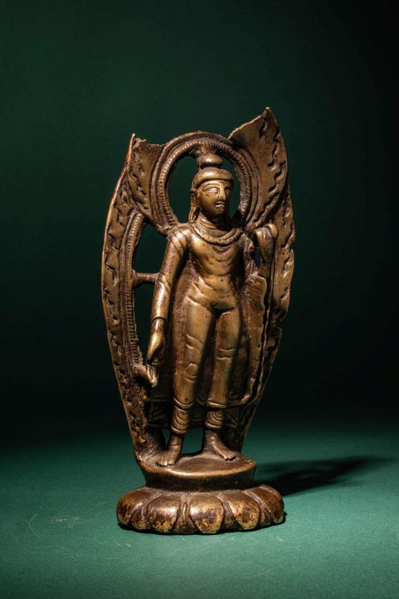 Apollo Art AuctionsCa. 10th - 11th century AD. >
A finely cast bronze figure of Buddha Shakyamuni standing in a fron