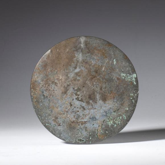 Bertolami Fine ArtA silver-plated copper mirror used in Taoism as a ritual instrument. China, 19th century.
