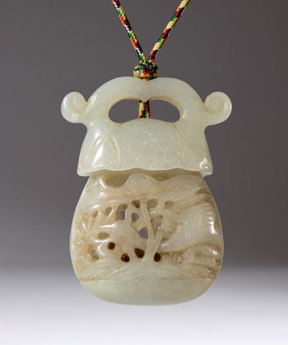 Bertolami Fine ArtA carved and perforated jade pendant container. Used as an essence holder. Inside is a small piece of scented sandalwood. China, Qing Dynasty (1644-1912), late 18th century.