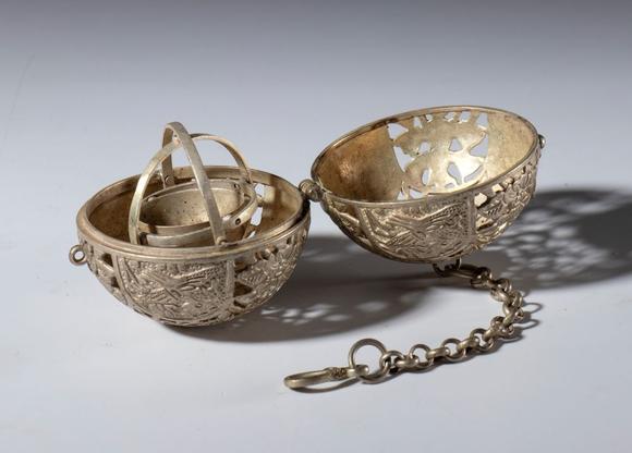 Bertolami Fine ArtLot comprising a silver-plated metal gyroscope sphere, two hand-engraved Kangxi Tongbao coins, and a copper alloy vajra. China, 20th century.