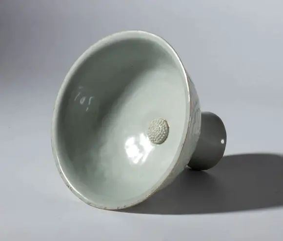 Bertolami Fine ArtA Qingbai ceramic stemmed cup decorated with a floral motif and a celadon glaze. China, Song Dynasty (960-1269).