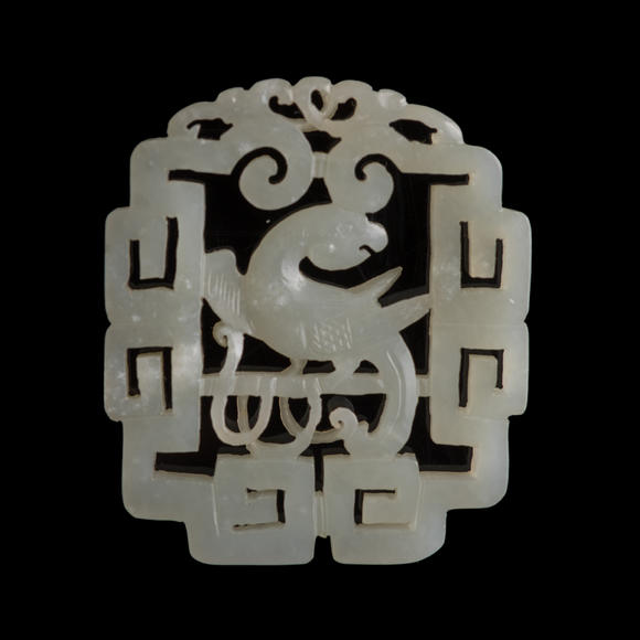 Oakridge Auction Gallery十八世紀 白玉鏤雕鸚鵡佩（附木座）  A Chinese reticulated white jade 'parrot' plaque