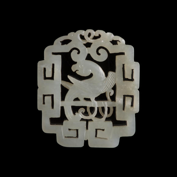 Oakridge Auction Gallery十八世紀 白玉鏤雕鸚鵡佩（附木座）  A Chinese reticulated white jade 'parrot' plaque