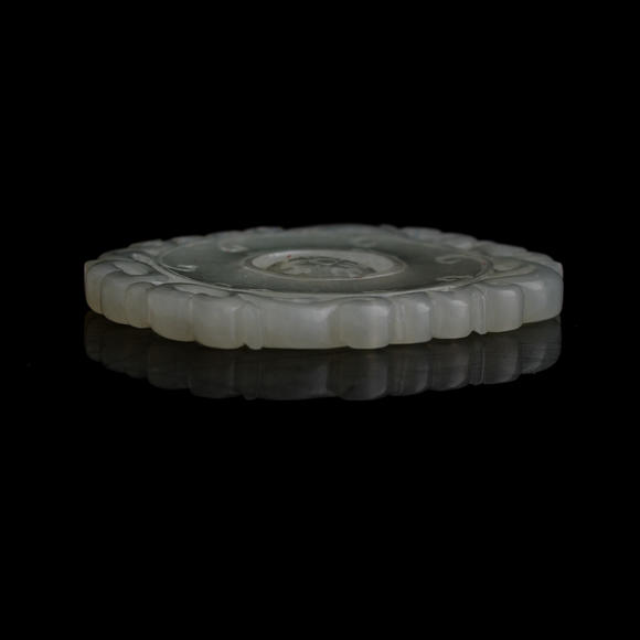 Oakridge Auction Gallery十八世紀 白玉轉心佩（附木座）  A Chinese carved white jade rotating-center pendant