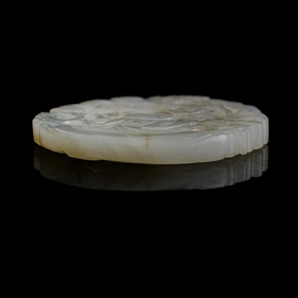 Oakridge Auction Gallery十九世紀早 白玉鏤雕童子佩（附木座）  A Chinese reticulated white jade 'boy' plaque