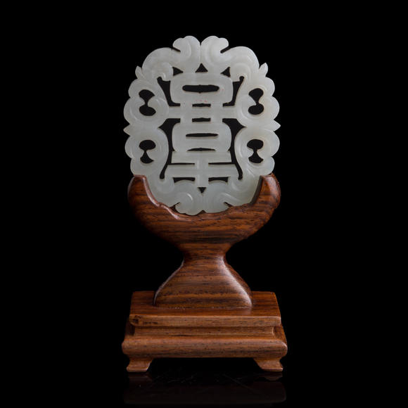 Oakridge Auction Gallery十九世紀(jì)早 白玉鏤雕喜字佩（附木座）  A Chinese reticulated white jade 'happiness' plaque