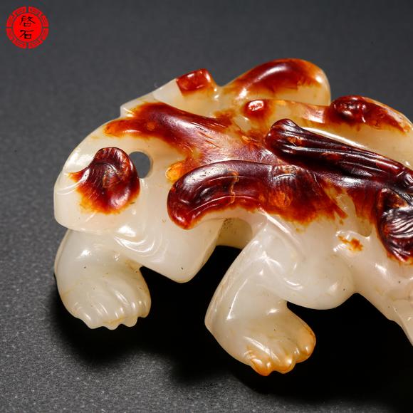 北京啟石明 紅皮白玉羽獸