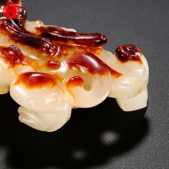 北京啟石明 紅皮白玉羽獸
