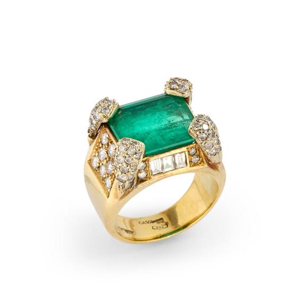 RoseberysAn Italian emerald and diamond ring, composed of a claw-set step-cut emerald, the claws, shoulders, and sides set with vari-cut diamonds, to plain tap