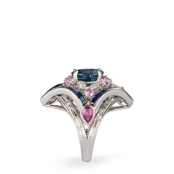 RoseberysA sapphire, diamond and pink sapphire cluster ring, the lozenge shaped cluster with central single oval mixed-cut sapphire in four claw setting, withi