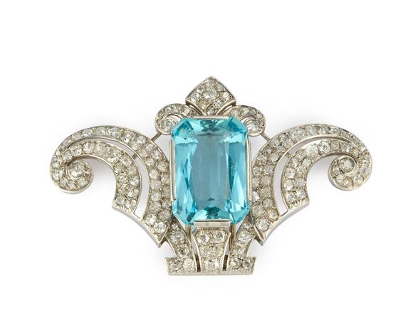 RoseberysA late Art Deco aquamarine and diamond clip, with detachable later hinged bangle, the clip set with a rectangular mixed-cut aquamarine, estimated as a