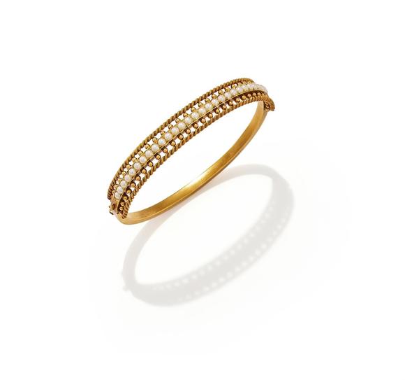 DreweattsAN EARLY 20TH CENTURY HALF PEARL BANGLE