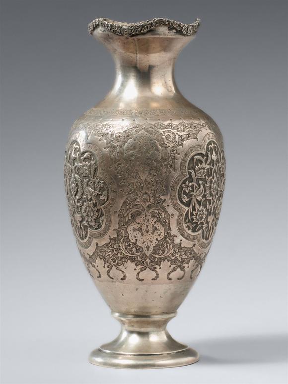 Kunsthaus Lempertz KGAn Persian ornate silver repoussé vase. Probably 19th century