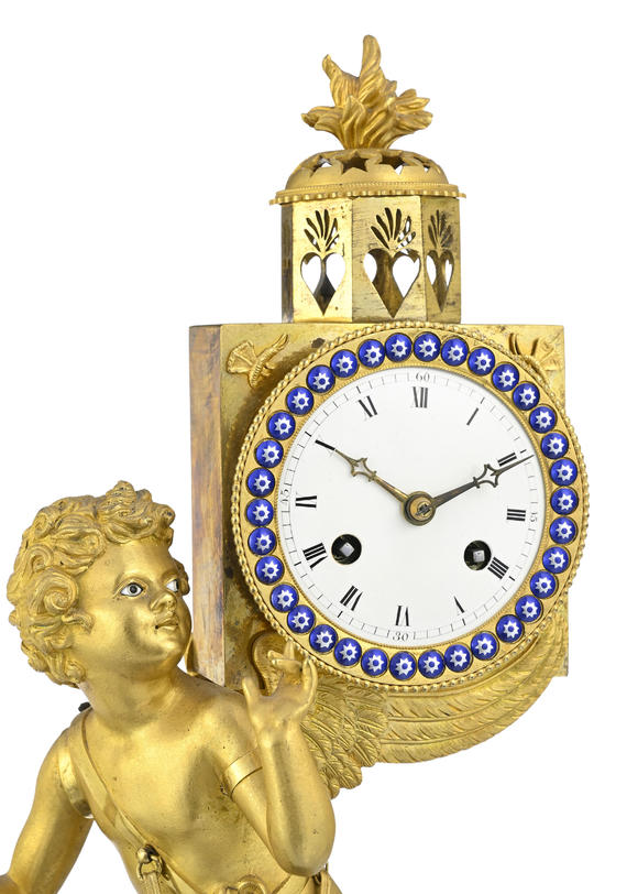 Piguet - H?tel des VentesPendule dite à lanterne magique d'époque Restauration, en bronze doré et finement ciselé, 47x25x14 cm