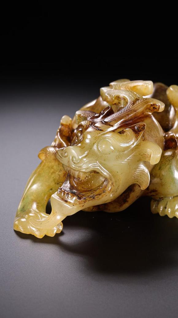 HUNG YUN ZHAI AUCTION HOUSE INCPre-Ming Dynasty Hetian Jade Auspicious Beast