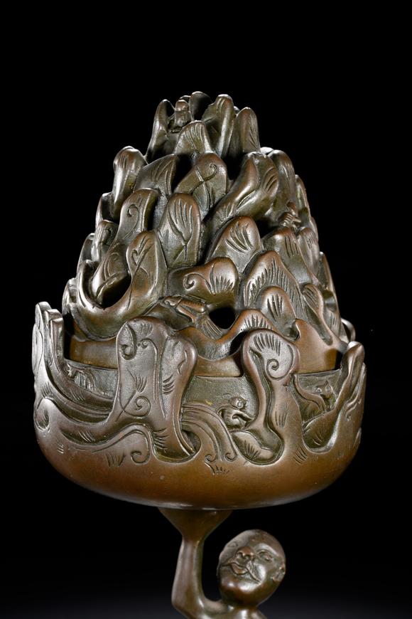 HUNG YUN ZHAI AUCTION HOUSE INCBronze Boshan Incense Burner with Central Asian (Hu) Figure Riding a Beast