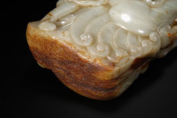 HUNG YUN ZHAI AUCTION HOUSE INCPre-Ming Dynasty or Earlier Hetian Jade Dragon-Head Ornament