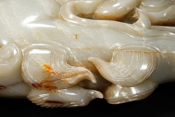 HUNG YUN ZHAI AUCTION HOUSE INCPre-Ming Dynasty or Earlier Hetian Jade Dragon-Head Ornament