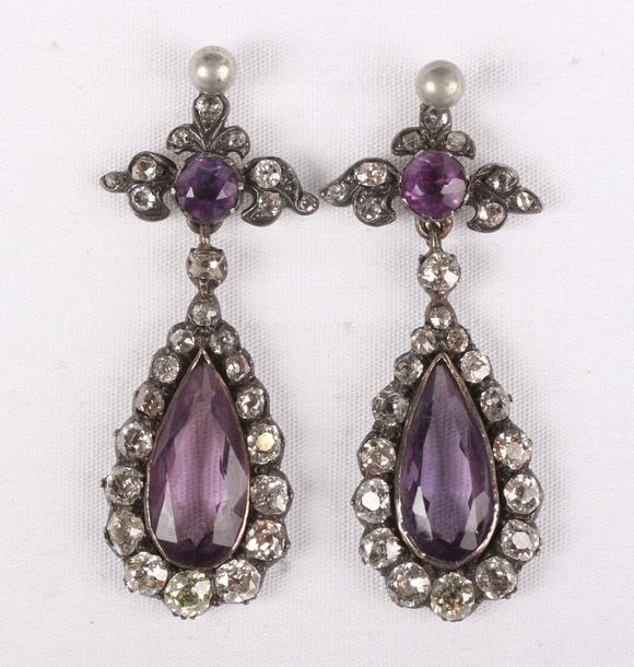 TooveysA pair of gold backed and silver set, diamond and amethyst drop shap