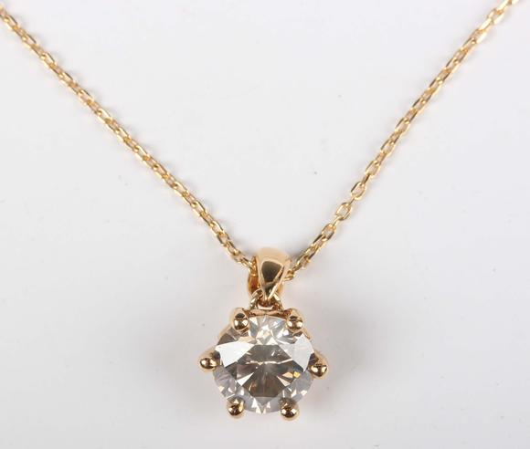 TooveysAn 18ct gold and diamond single stone pendant, claw set with a circu