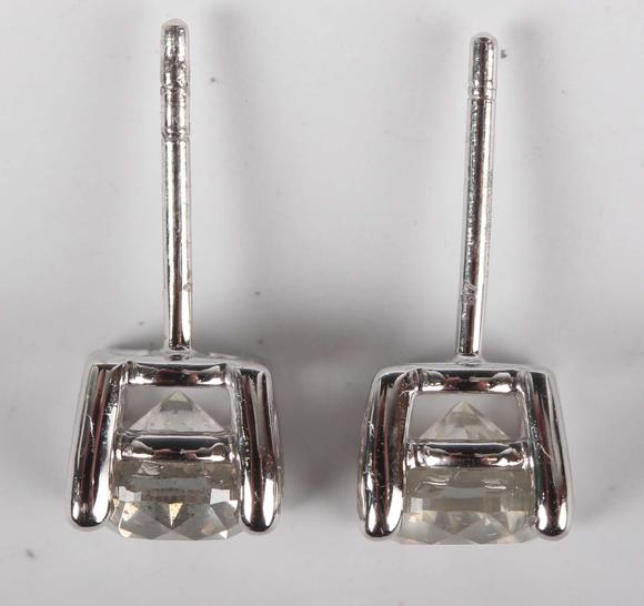 TooveysA pair of platinum and diamond single stone earstuds, each claw set