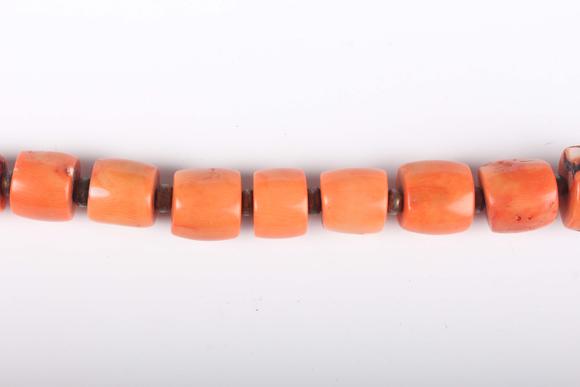TooveysA single row necklace of graduated barrel form dyed coral beads, Nor