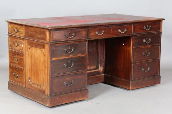 TooveysA good late George III mahogany twin-pedestal desk, in the manner of